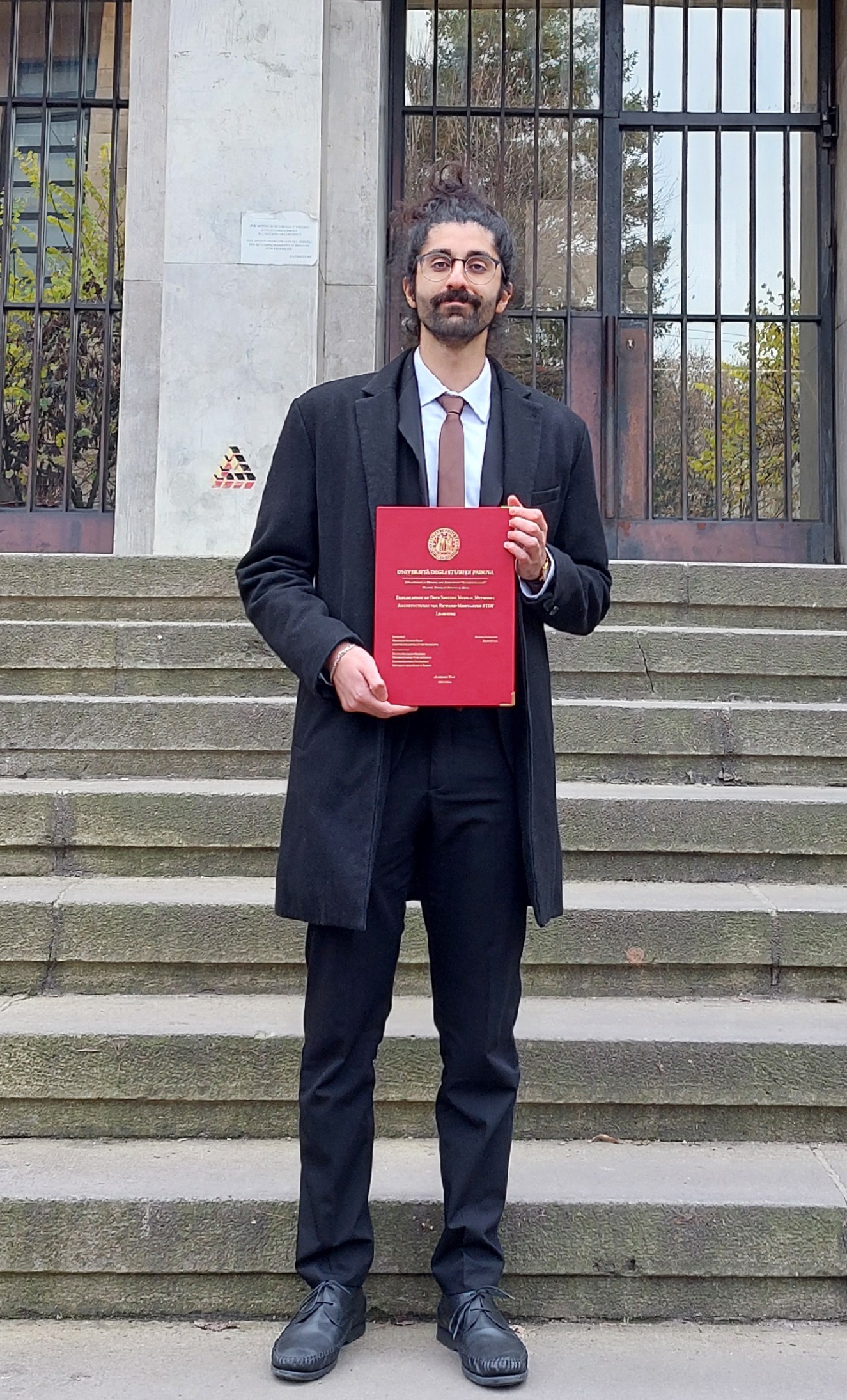 Portrait taken on graduation day at the University of Padova